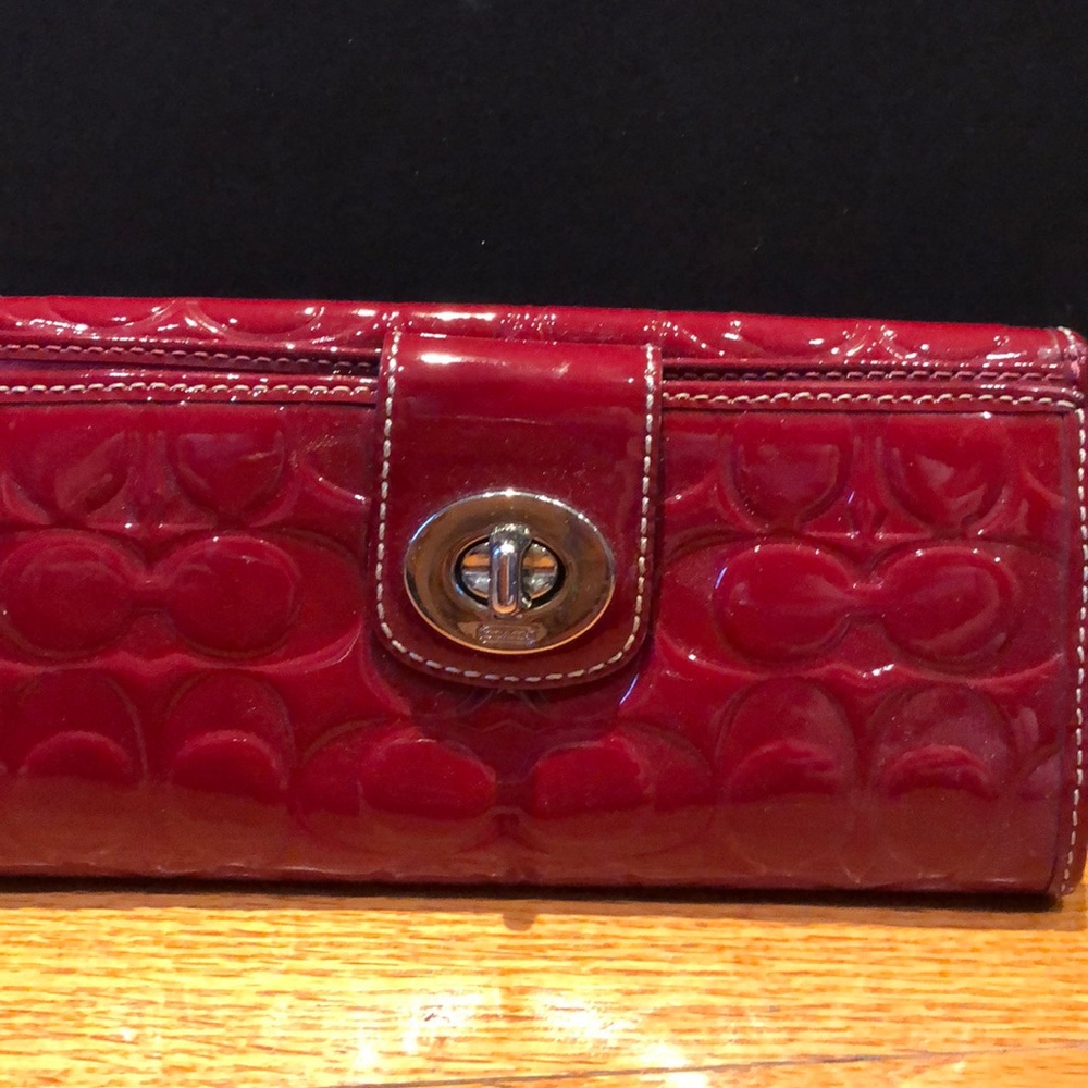 Red patent leather “c” embossed coach wallet
